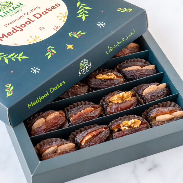 A beautifully arranged Festive Edition box of Medjool dates filled with assorted nuts, styled elegantly for celebrations and special occasions.