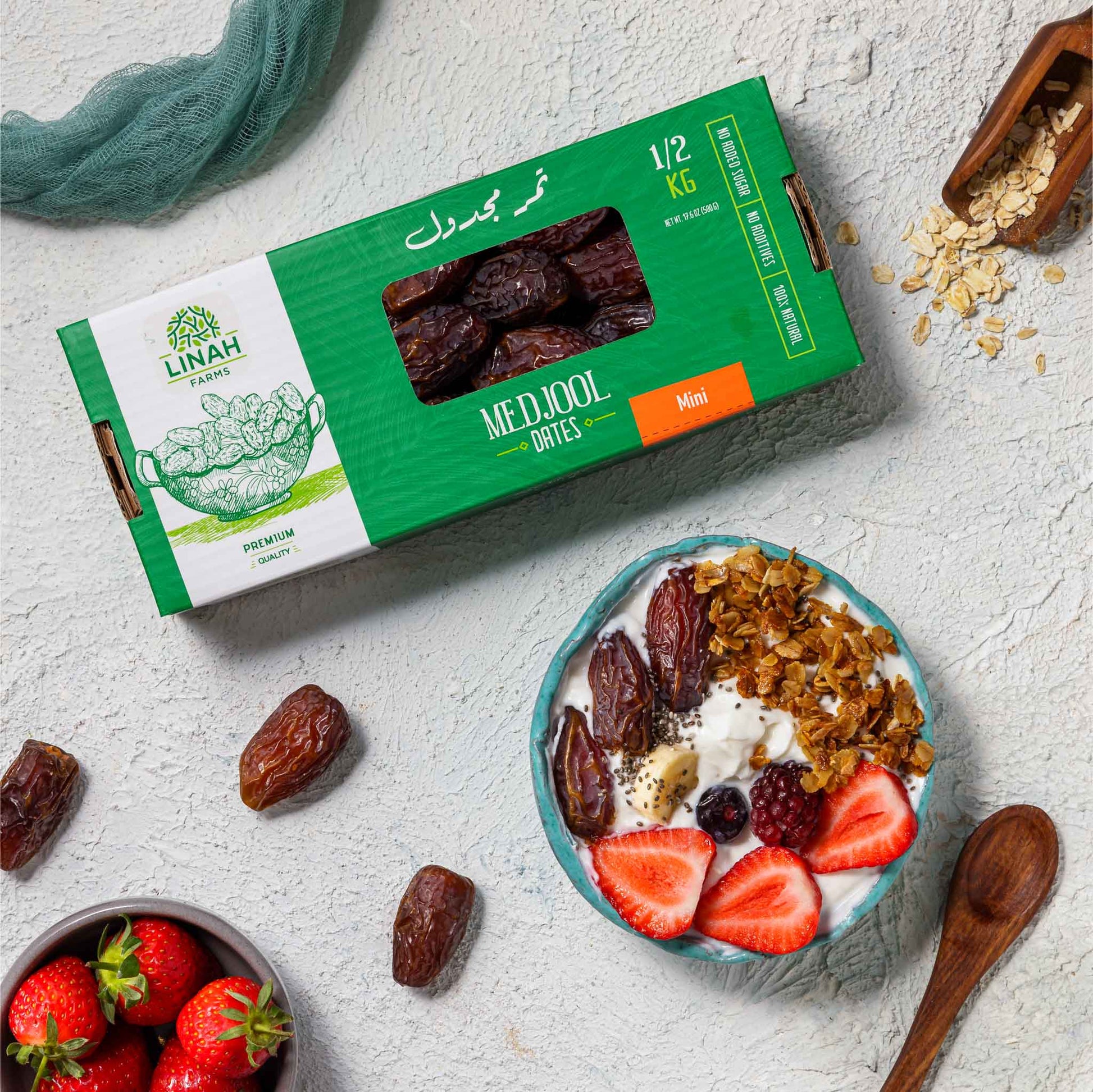 Linah Farms' Mini Medjool Dates 500 g box with breakfast granola bowl and fruits 