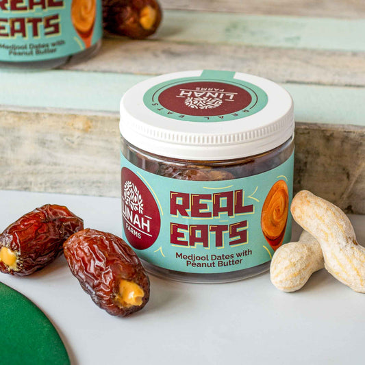 real eats jar with two medjool dates with peanut butter on the side